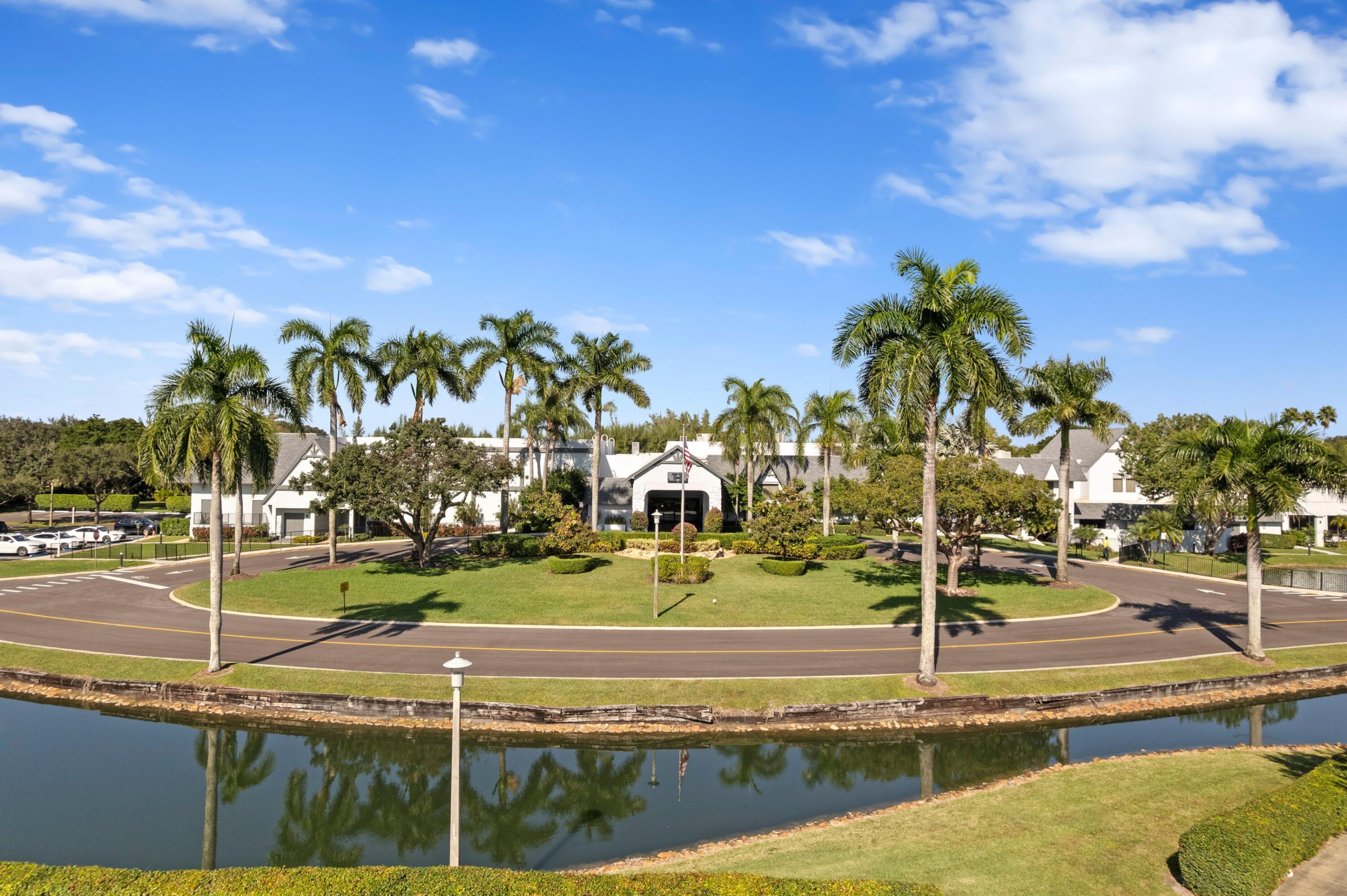 14360 Strathmore Lane, Unit 404 Delray Beach, FL 33446 - Photo 24 of 42 a view of a tennis court
