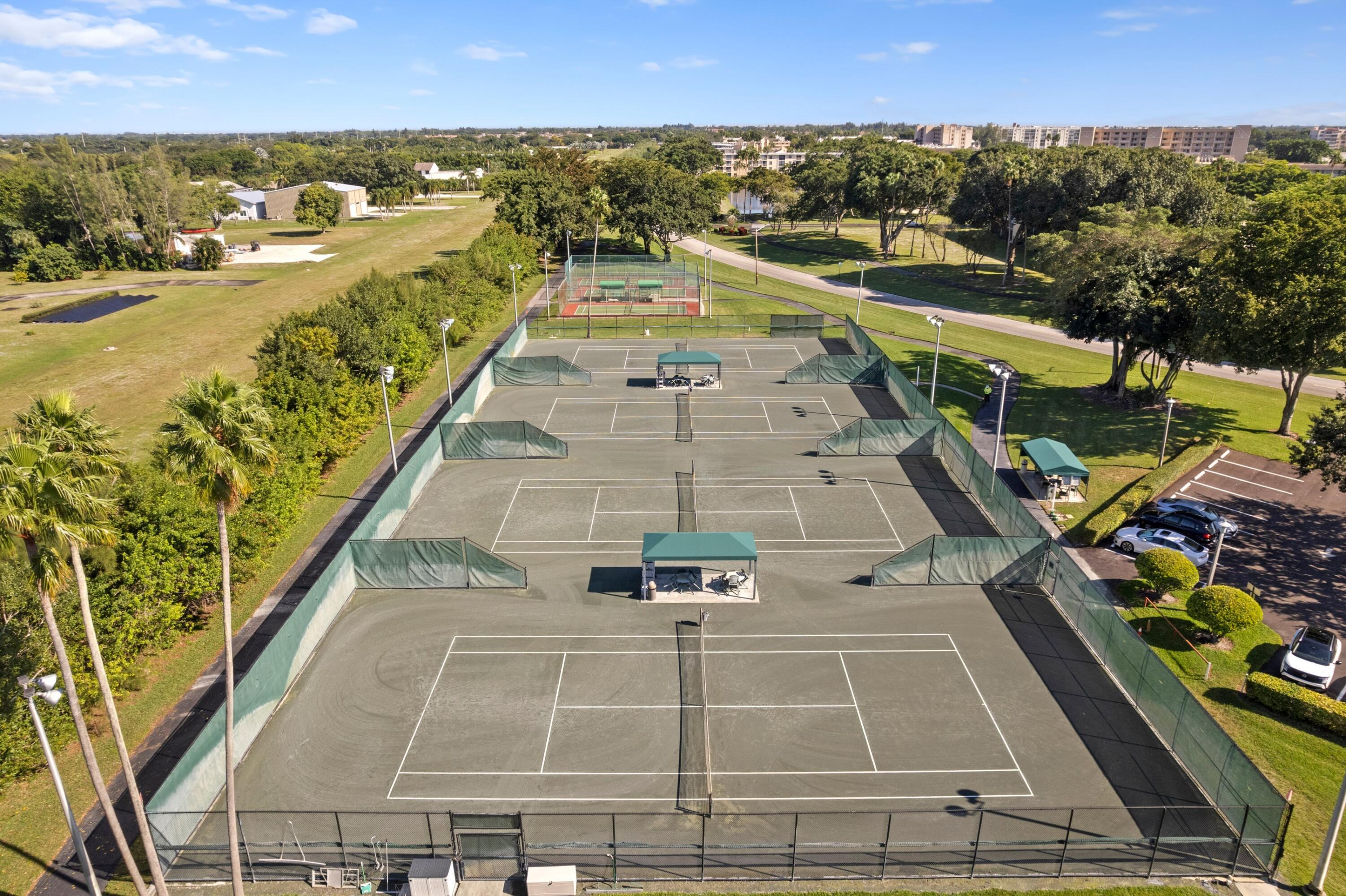 14360 Strathmore Lane, Unit 404 Delray Beach, FL 33446 - Photo 26 of 42 a view of a city with lawn chairs