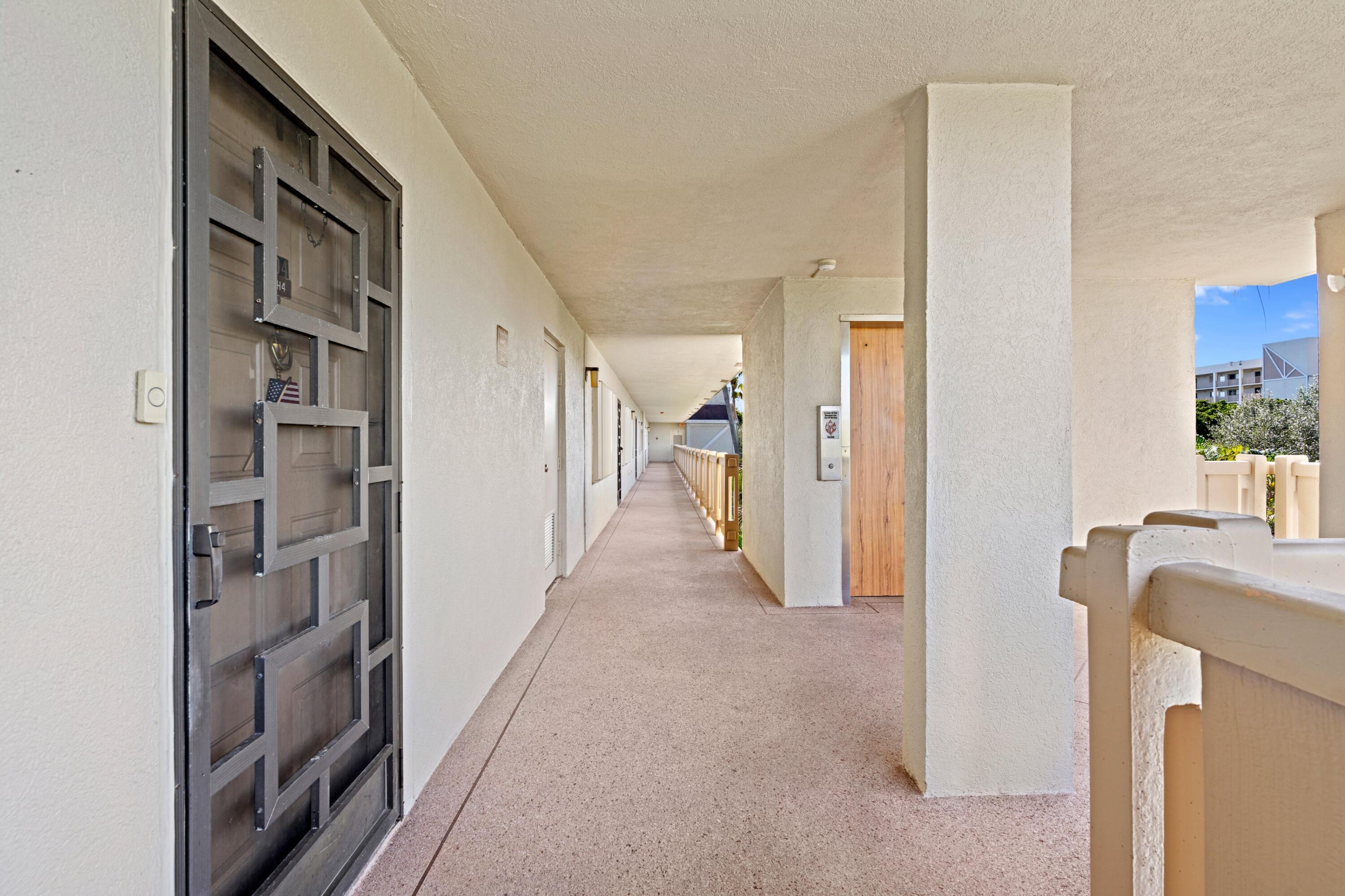 14360 Strathmore Lane, Unit 404 Delray Beach, FL 33446 - Photo 28 of 42 a view of hallway with livingroom and bedroom