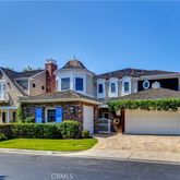 a front view of a house with a garden and yard