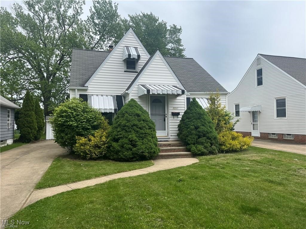 1397 Sunset Road Cleveland, OH 44124 - Photo 1 of 32 Bungalow-style home featuring a front yard, roof with shingles, and entry steps