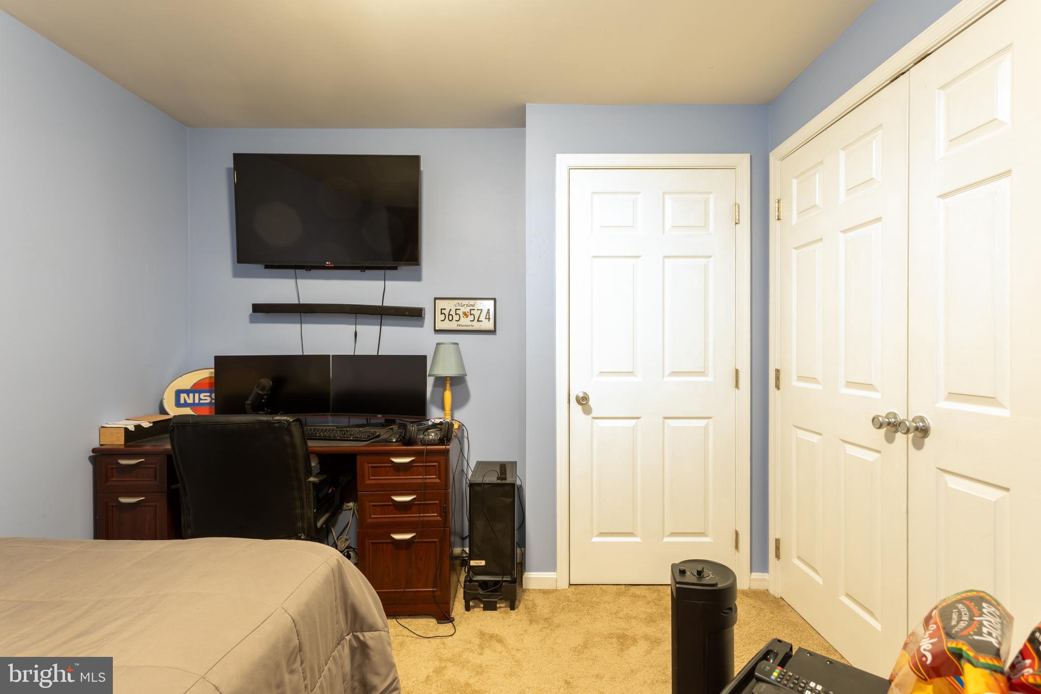 1715 Waltman Road Edgewood, MD 21040 - Photo 47 of 58 a bedroom with a bed and a flat screen tv