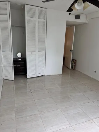 a bed room with a bed and a window