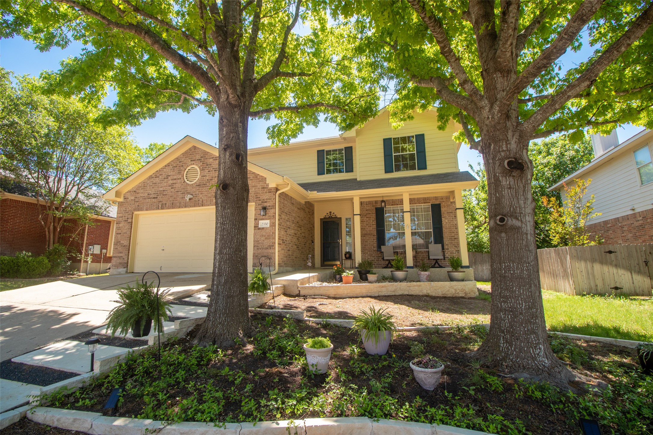 2330 Candle Ridge Trail Georgetown, TX 78626 - Photo 1 of 1 a front view of a house with garden