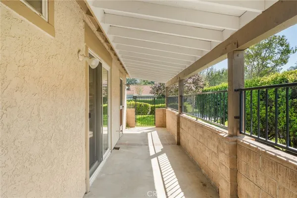 a view of a balcony with furniture