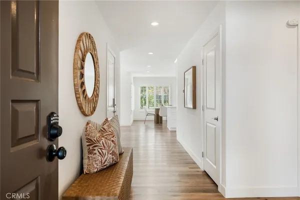 a view of a entryway door with wooden floor