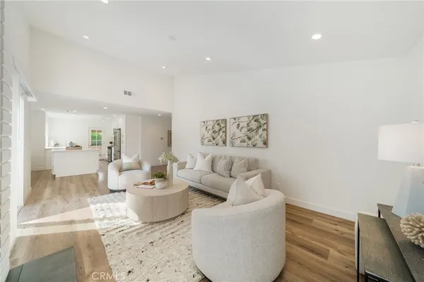 a living room with furniture and a lamp