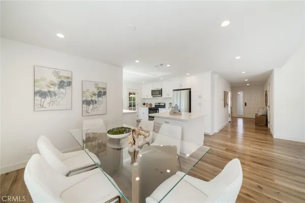 a living room with fireplace furniture and a wooden floor
