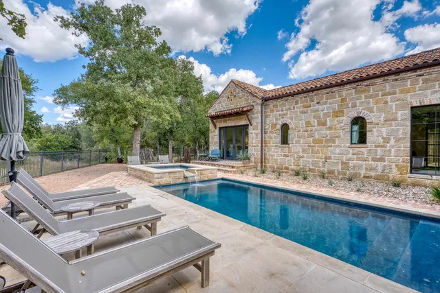 a view of a kitchen with a sink and dishwasher with outdoor seating
