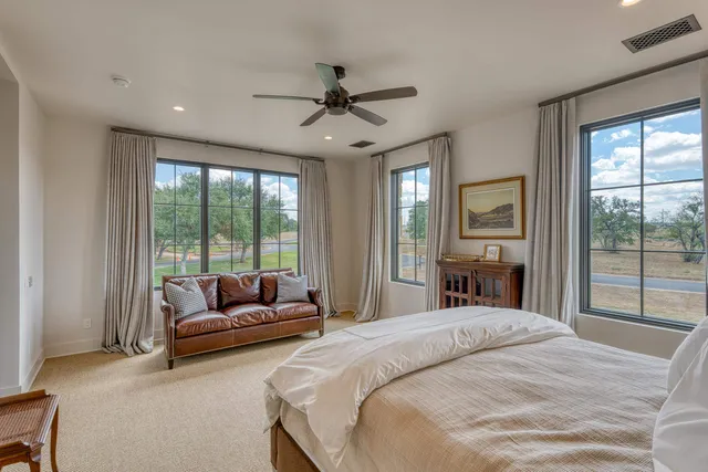 a bedroom with a bed and a couch