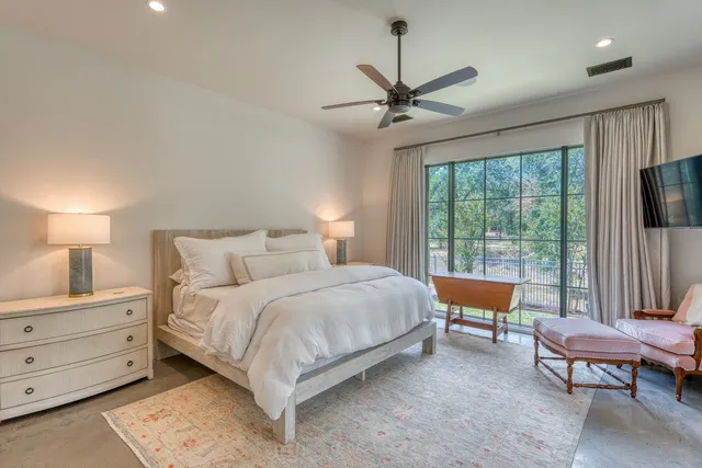 a bedroom with bed and a window