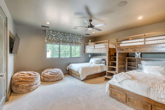 a bedroom with bed and window