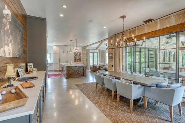 a large kitchen with a table and chairs