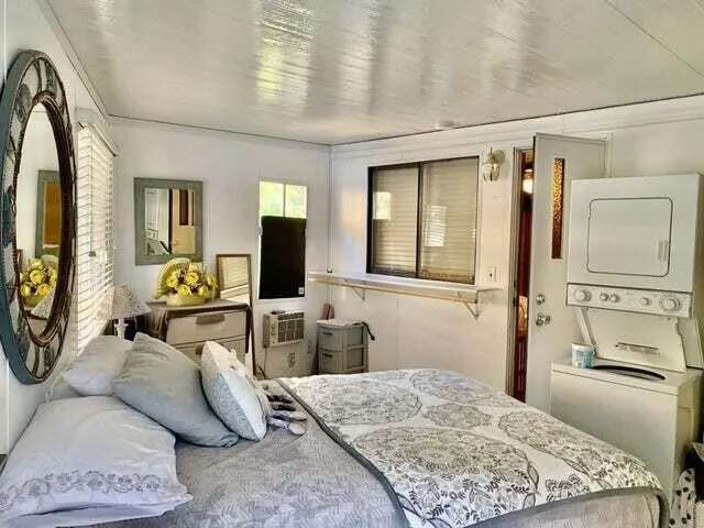 a bedroom with a bed and a dresser