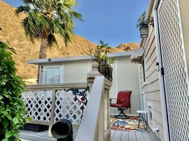 a front view of a house with wooden fence
