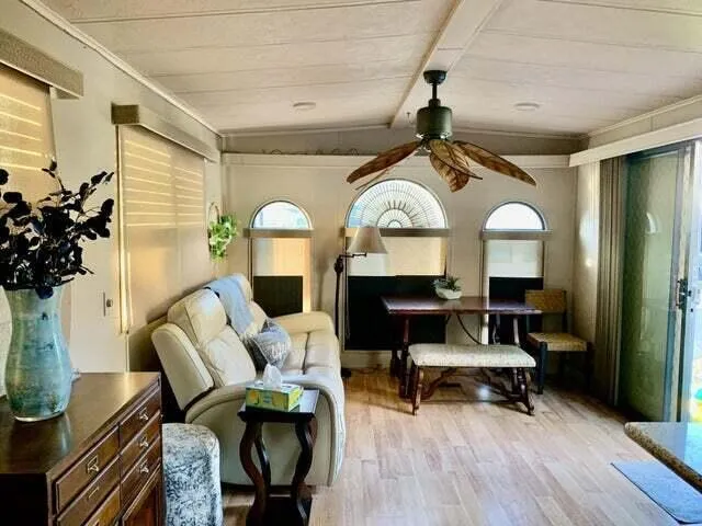 a spacious bedroom with a bed and a dresser