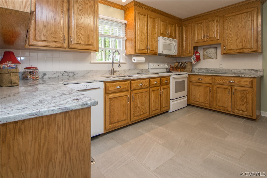 2701 East Brigstock Road Midlothian, VA 23113 - Photo 15 of 50 a kitchen with granite countertop cabinets sink and window