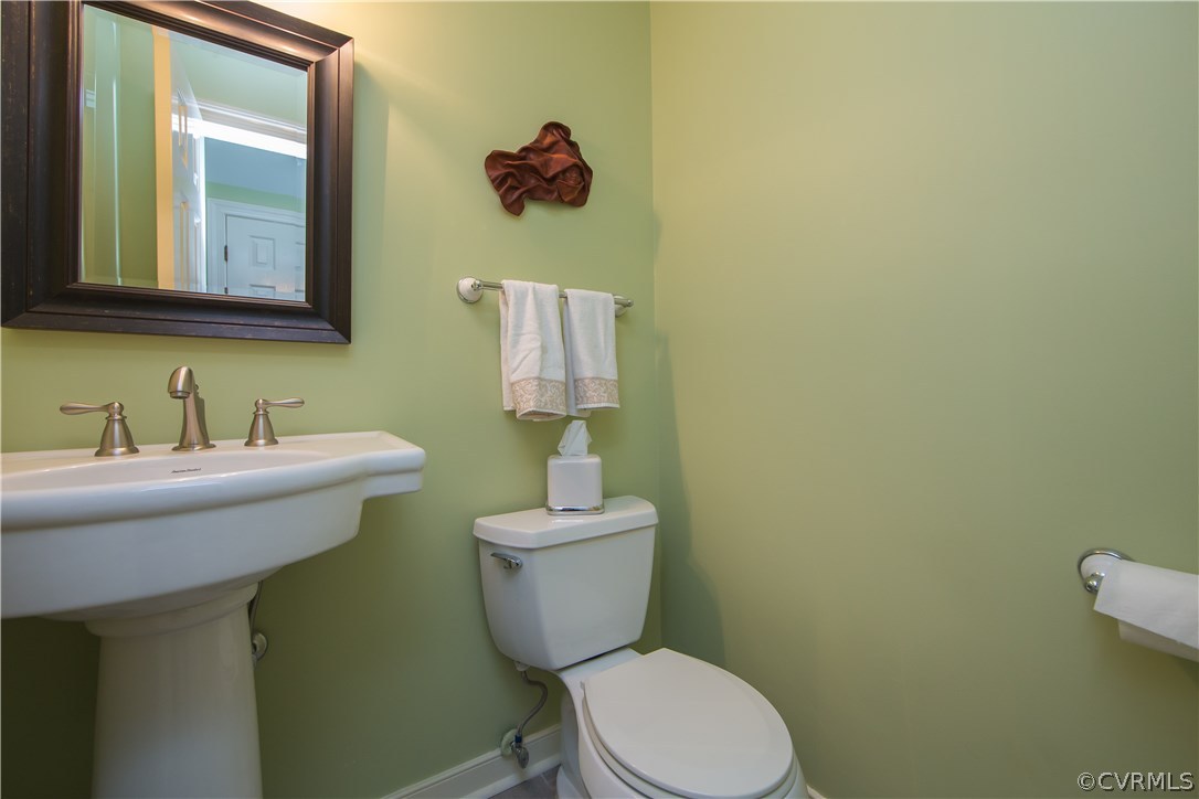2701 East Brigstock Road Midlothian, VA 23113 - Photo 18 of 50 a bathroom with a toilet sink and mirror