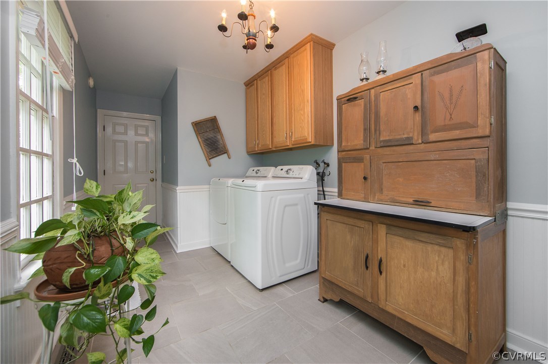 2701 East Brigstock Road Midlothian, VA 23113 - Photo 19 of 50 a utility room with cabinets washer and dryer