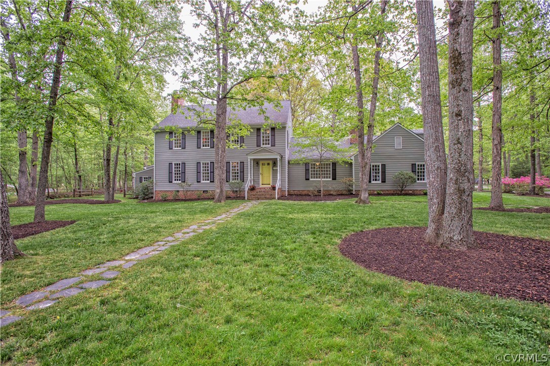 2701 East Brigstock Road Midlothian, VA 23113 - Photo 2 of 50 a view of a house with a big yard and large trees