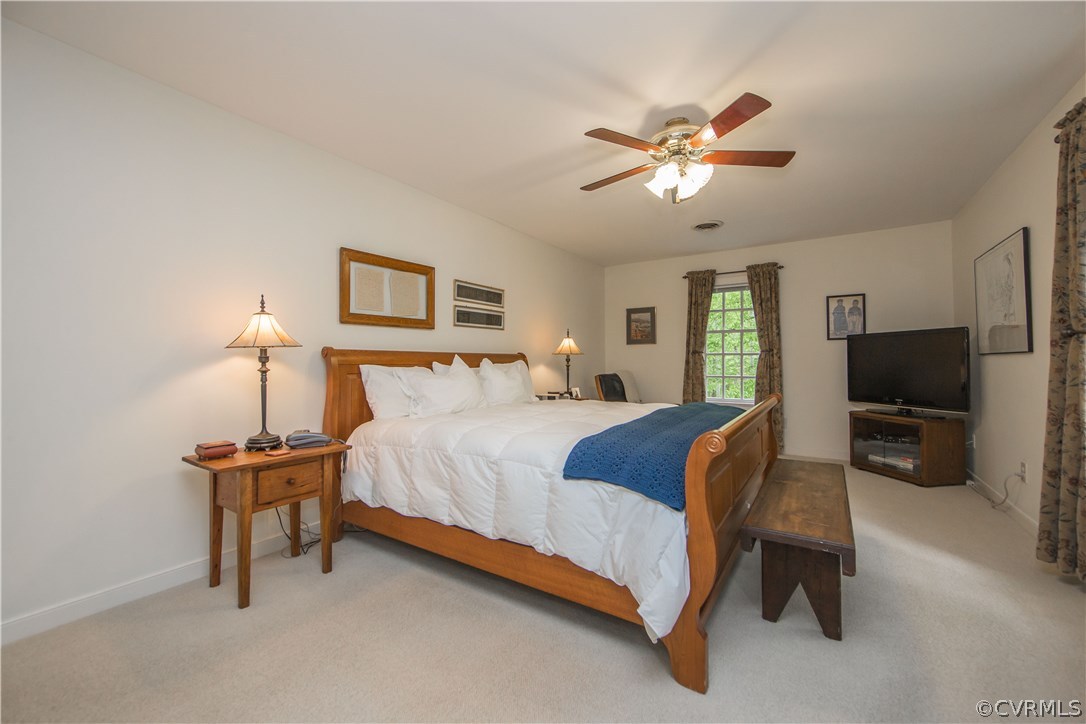 2701 East Brigstock Road Midlothian, VA 23113 - Photo 28 of 50 a bedroom with a bed and a flat screen tv