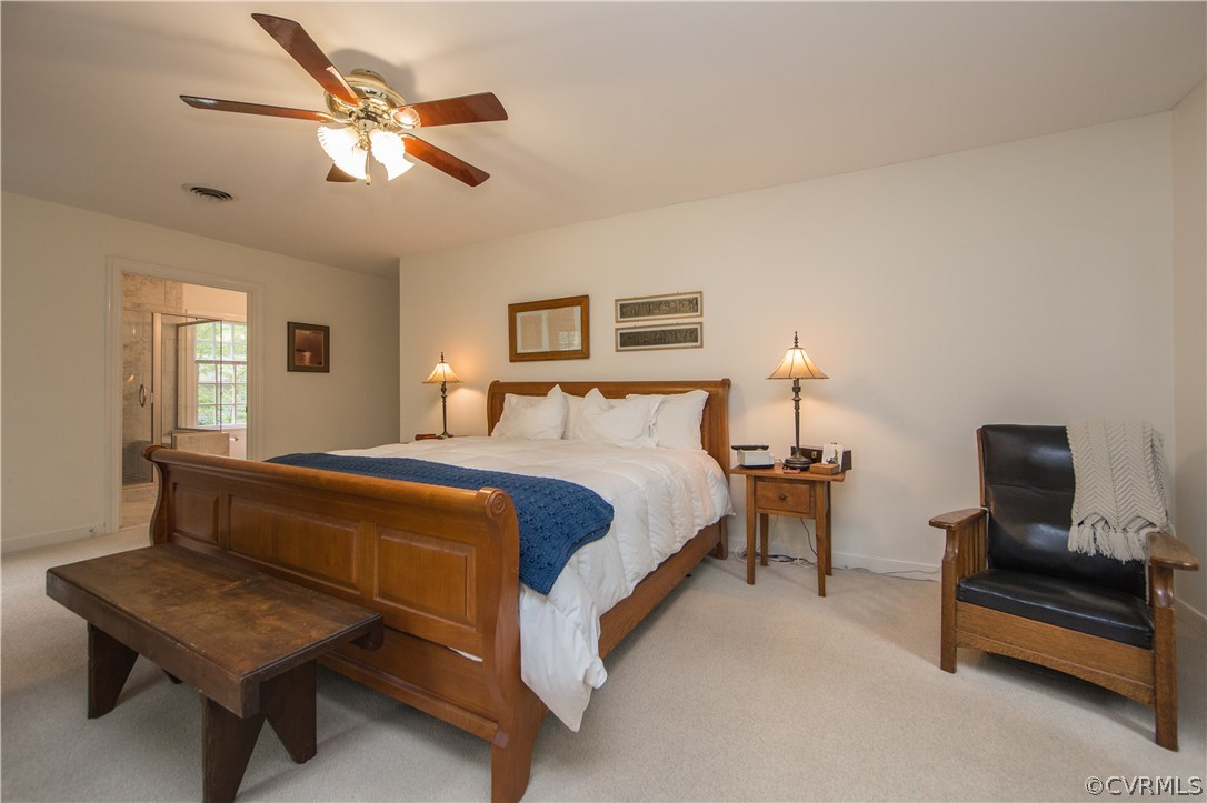 2701 East Brigstock Road Midlothian, VA 23113 - Photo 30 of 50 a bedroom with a bed and a chandelier