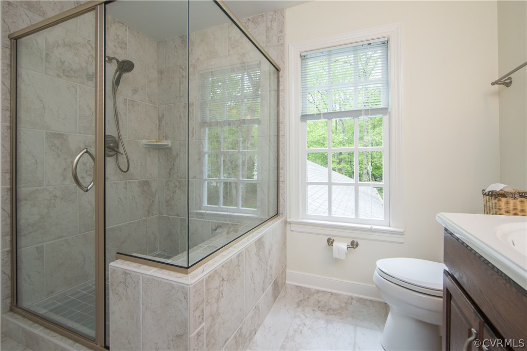 2701 East Brigstock Road Midlothian, VA 23113 - Photo 32 of 50 a bathroom with a sink toilet and shower