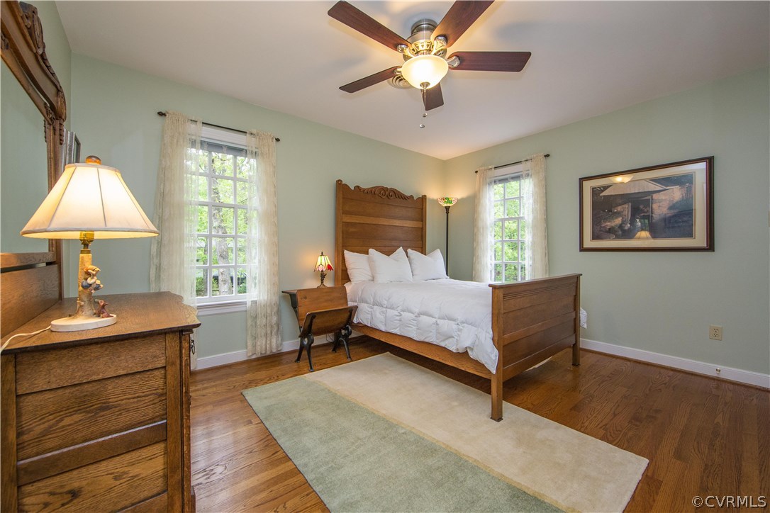 2701 East Brigstock Road Midlothian, VA 23113 - Photo 36 of 50 a bedroom with a bed and a chandelier
