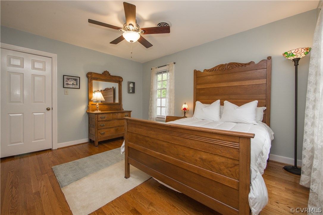 2701 East Brigstock Road Midlothian, VA 23113 - Photo 37 of 50 a bedroom with a bed and a chandelier