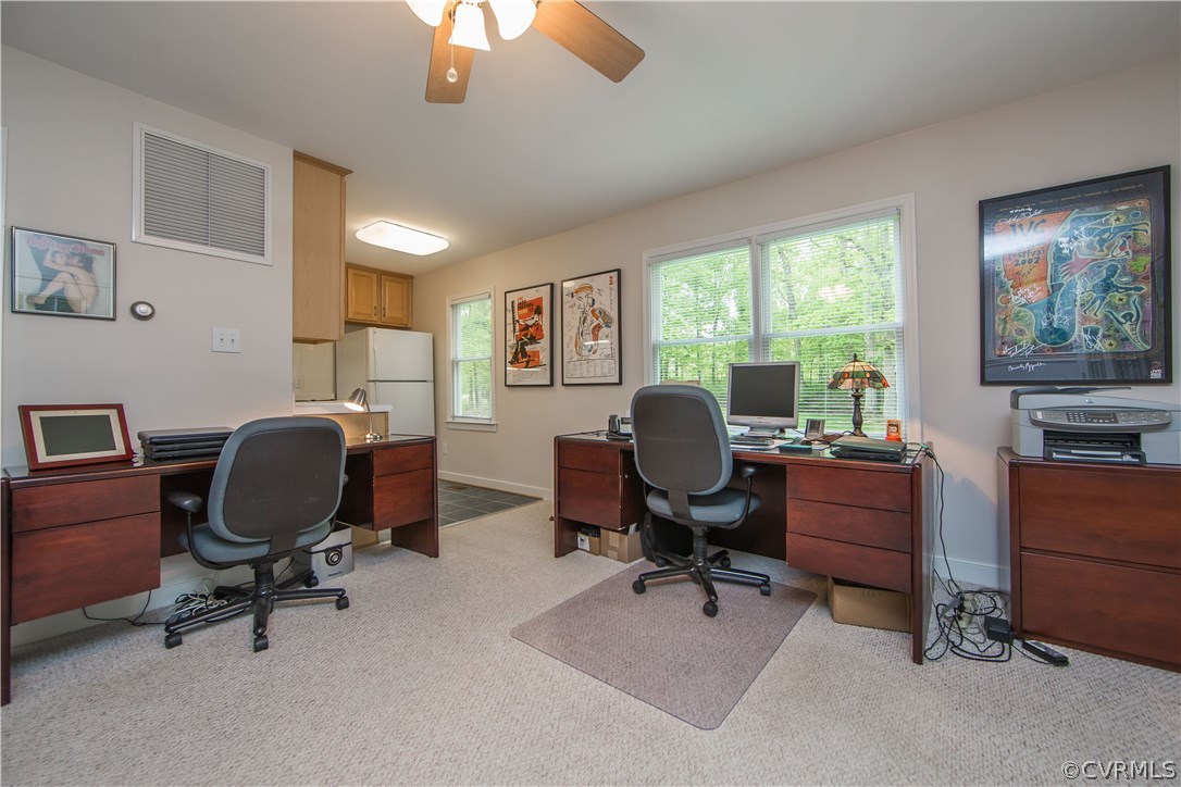 2701 East Brigstock Road Midlothian, VA 23113 - Photo 39 of 50 a view of a workspace with furniture and a window