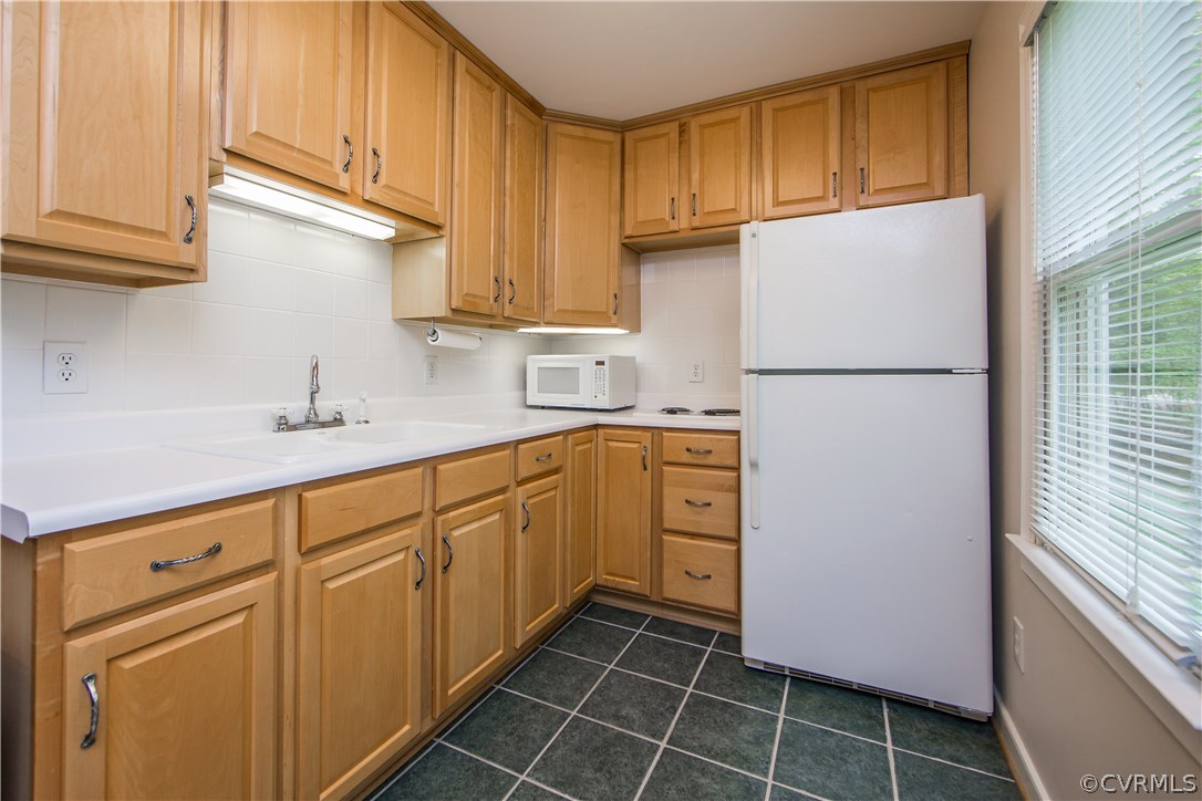 2701 East Brigstock Road Midlothian, VA 23113 - Photo 41 of 50 a kitchen with a refrigerator sink and cabinets