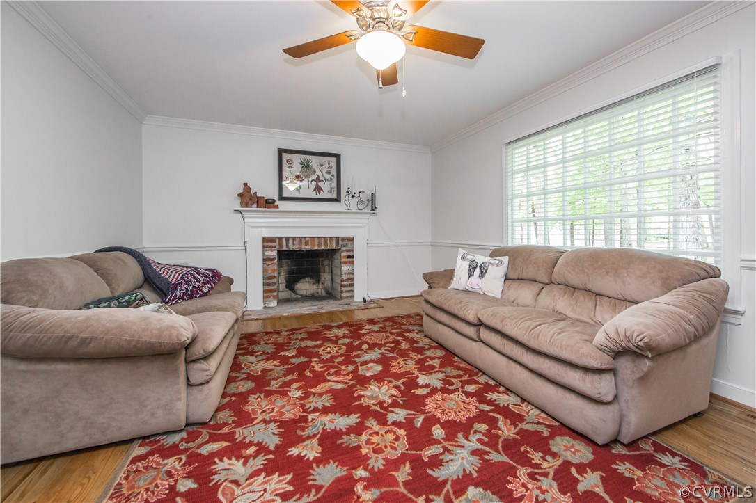 2701 East Brigstock Road Midlothian, VA 23113 - Photo 47 of 50 a living room with furniture and a fireplace