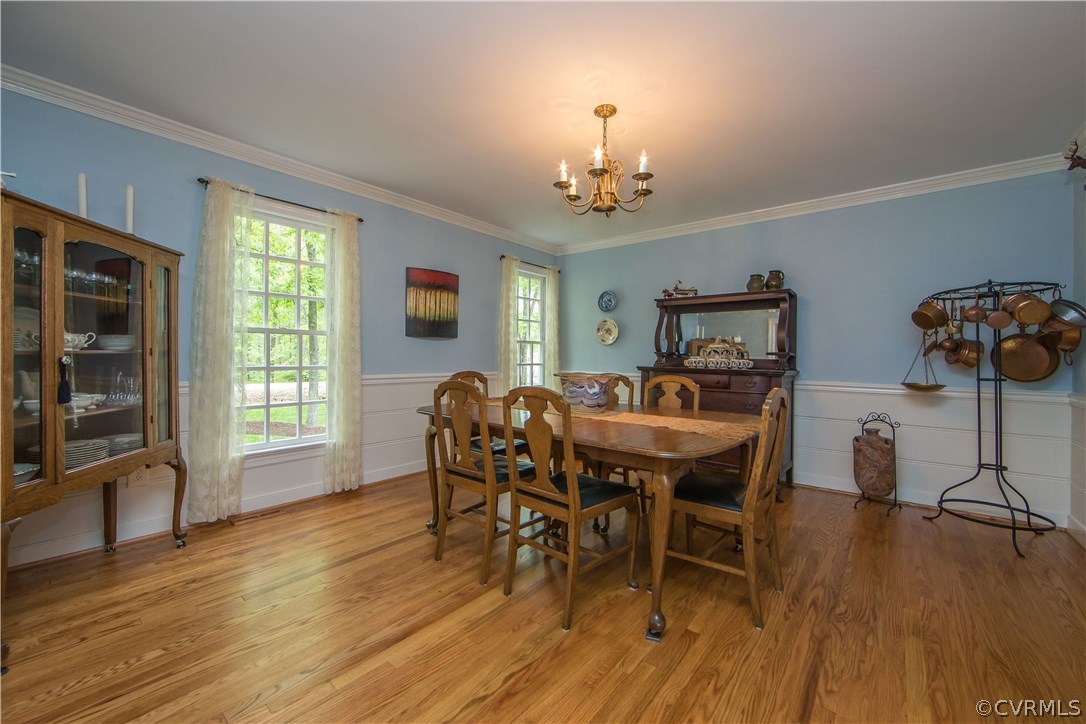 2701 East Brigstock Road Midlothian, VA 23113 - Photo 48 of 50 a view of a dining room with furniture window and wooden floor