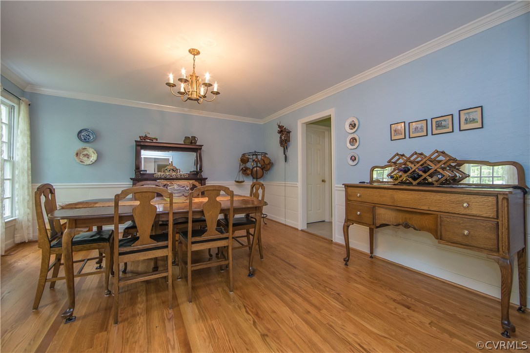 2701 East Brigstock Road Midlothian, VA 23113 - Photo 49 of 50 a view of a dining room with furniture and wooden floor
