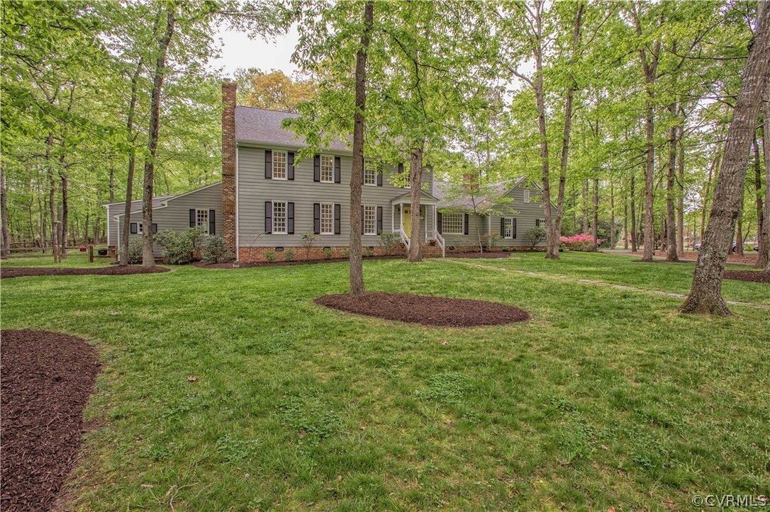 2701 East Brigstock Road Midlothian, VA 23113 - Photo 5 of 50 a front view of a house with a yard