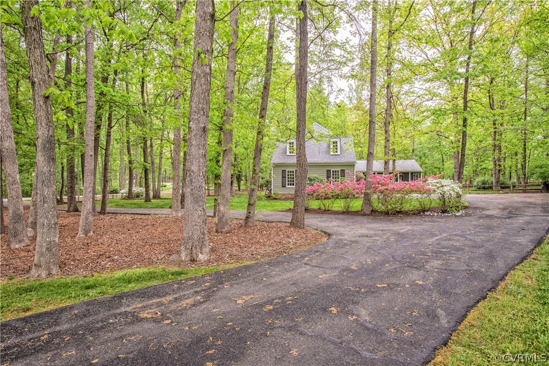 2701 East Brigstock Road Midlothian, VA 23113 - Photo 7 of 50 a house with trees in front of it