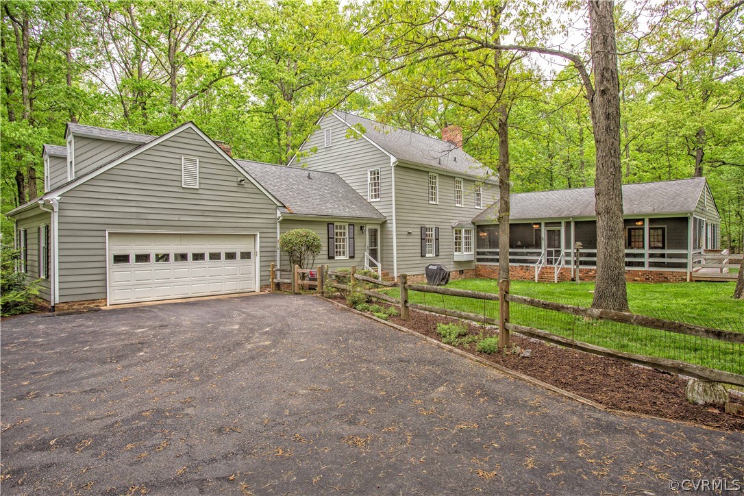 2701 East Brigstock Road Midlothian, VA 23113 - Photo 8 of 50 a view of a house with a yard and large tree