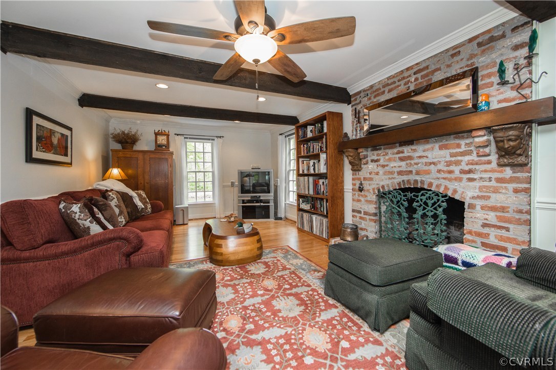 2701 East Brigstock Road Midlothian, VA 23113 - Photo 10 of 50 a living room with furniture and a fireplace
