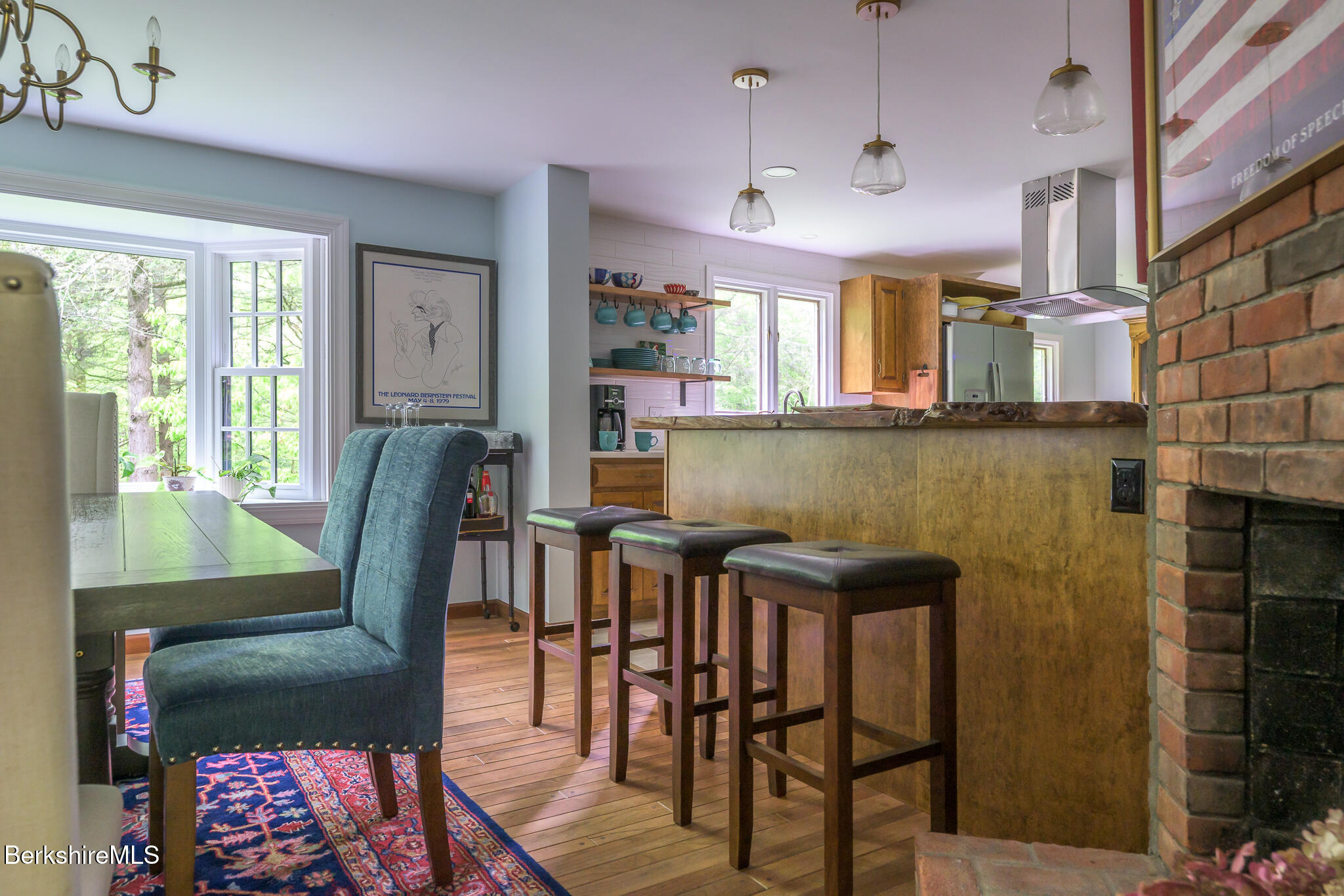 29 Osceola Notch Road Richmond, MA 01254 - Photo 9 of 32 a view of a dining room with furniture and wooden floor