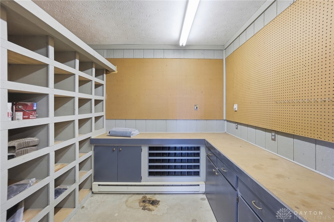 5669 O Neall Road Waynesville, OH 45068 - Photo 59 of 72 Functional workspace with built-in storage and convenient pegboard walls inside the Morton barn.