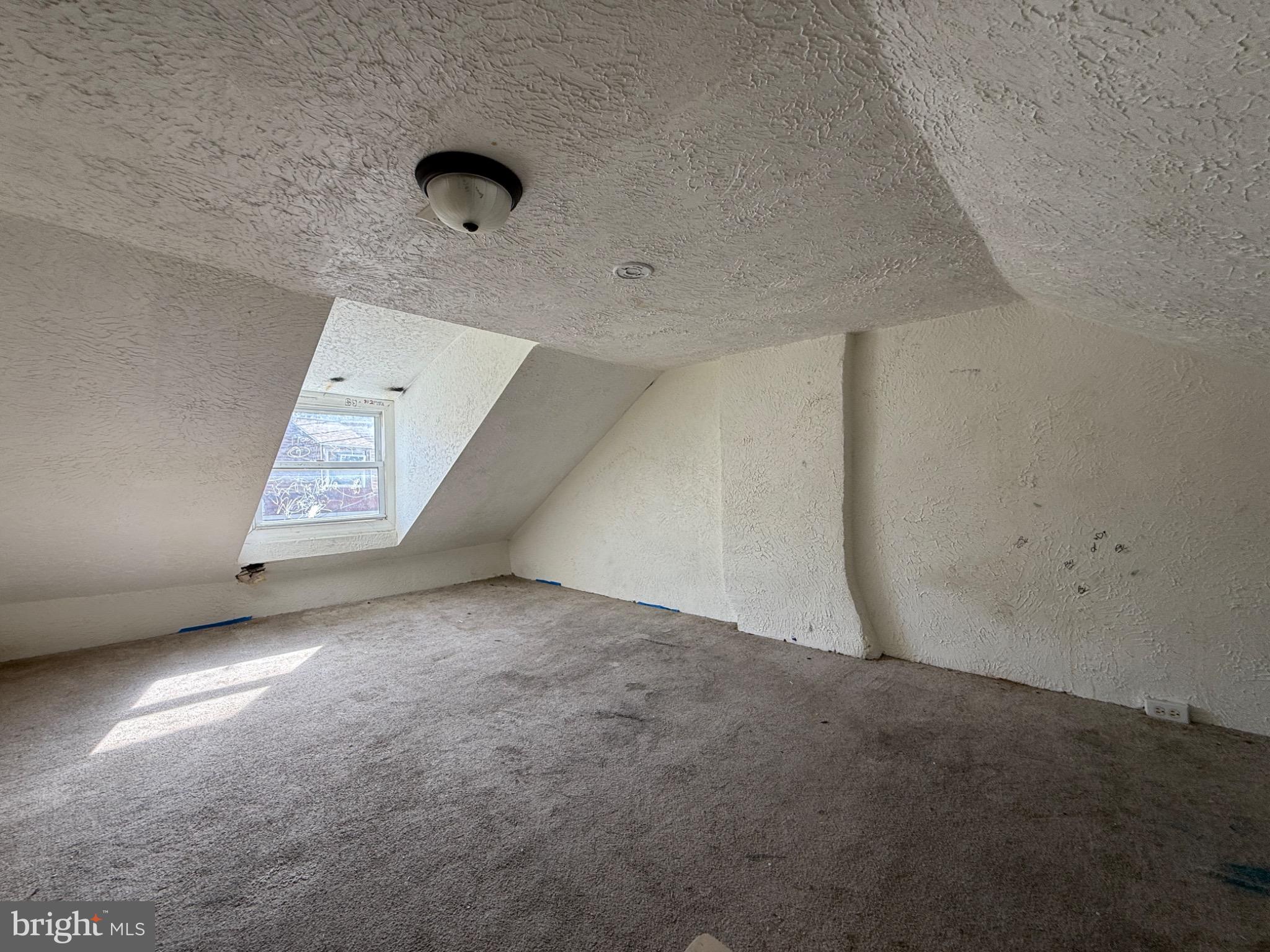 446 Spring Garden Street Reading, PA 19602 - Photo 9 of 9 Spacious attic with natural light.