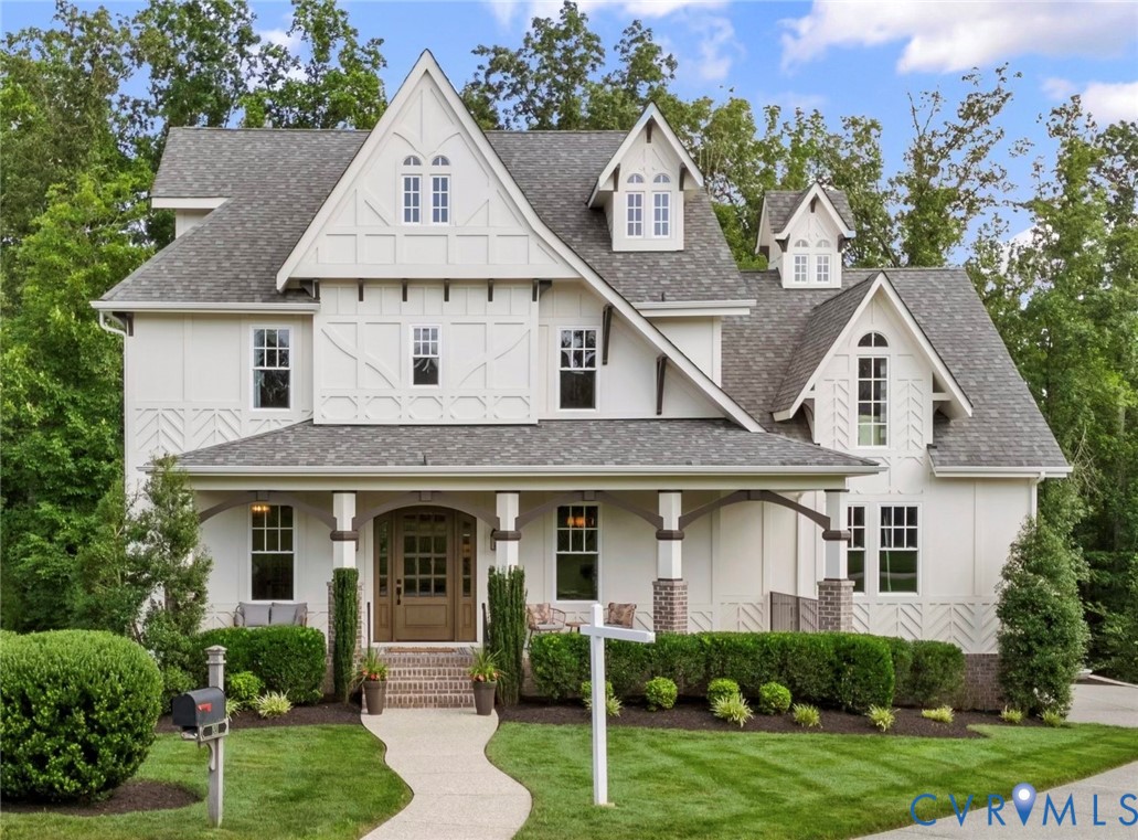 1931 Muswell Court Midlothian, VA 23112 - Photo 1 of 50 a front view of a house with a yard and potted plants