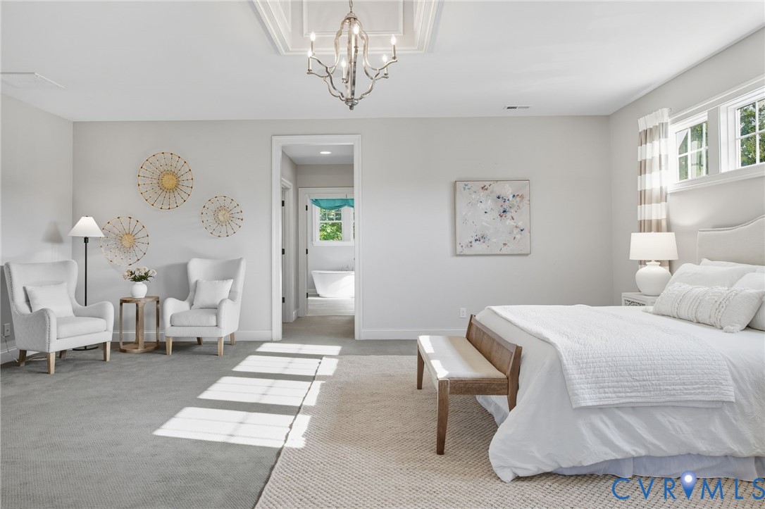 1931 Muswell Court Midlothian, VA 23112 - Photo 26 of 50 a bedroom with a bed a chandelier and a window