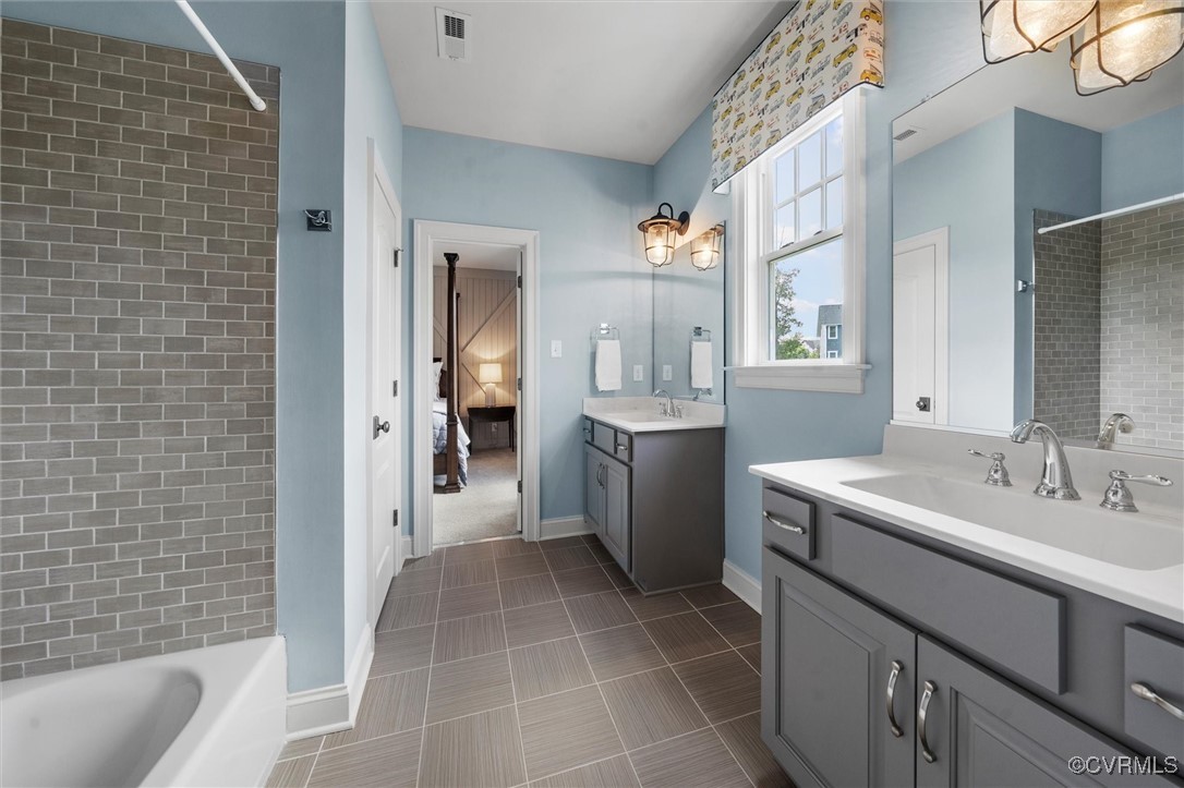 1931 Muswell Court Midlothian, VA 23112 - Photo 32 of 50 a bathroom with a sink a toilet a mirror and shower