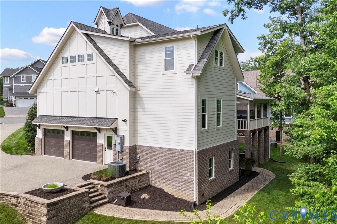 1931 Muswell Court Midlothian, VA 23112 - Photo 46 of 50 a front view of house with yard outdoor seating and garage