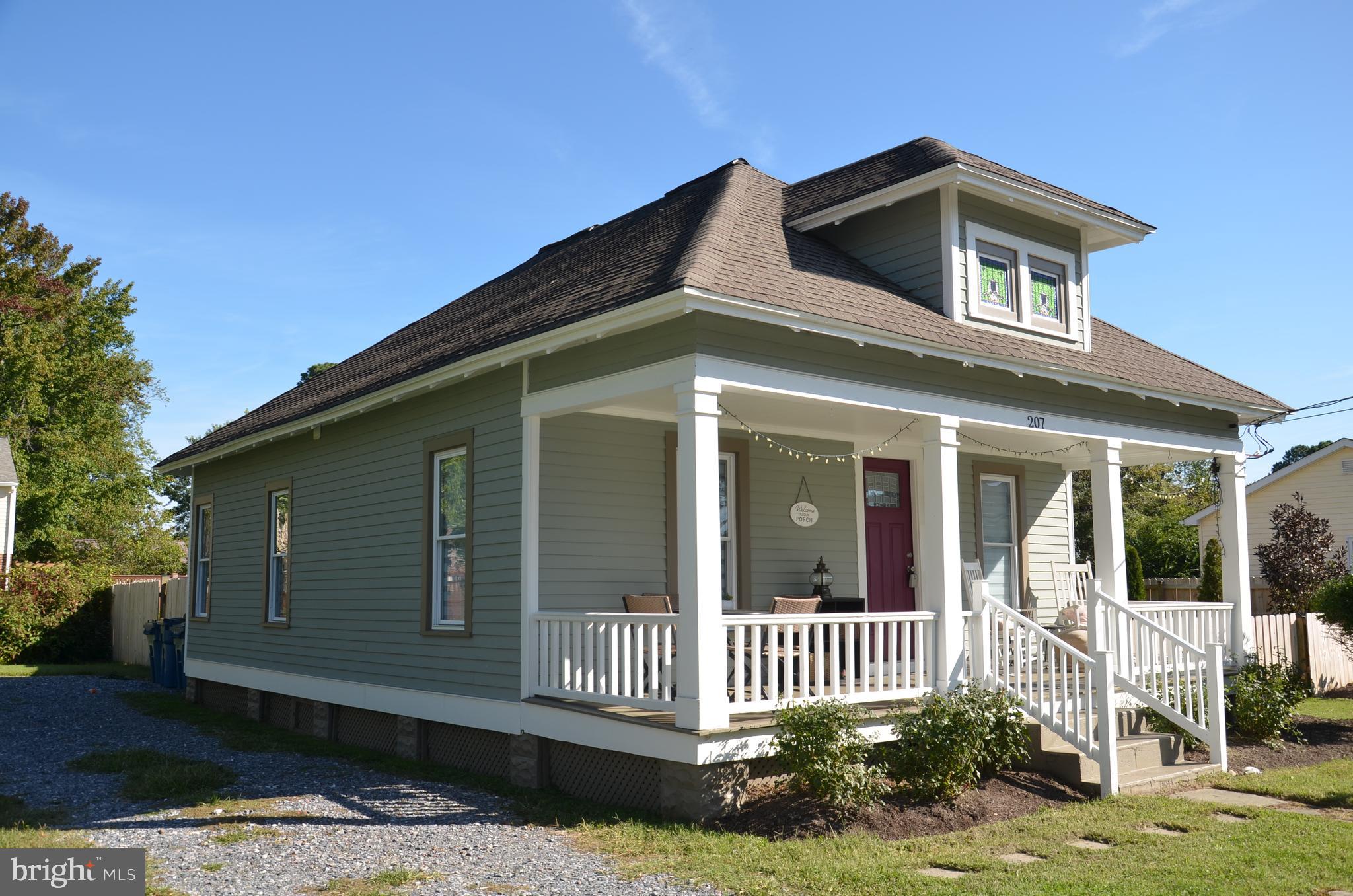 207 Dodson Avenue St. Michaels, MD 21663 - Photo 2 of 44 a front view of a house with a yard