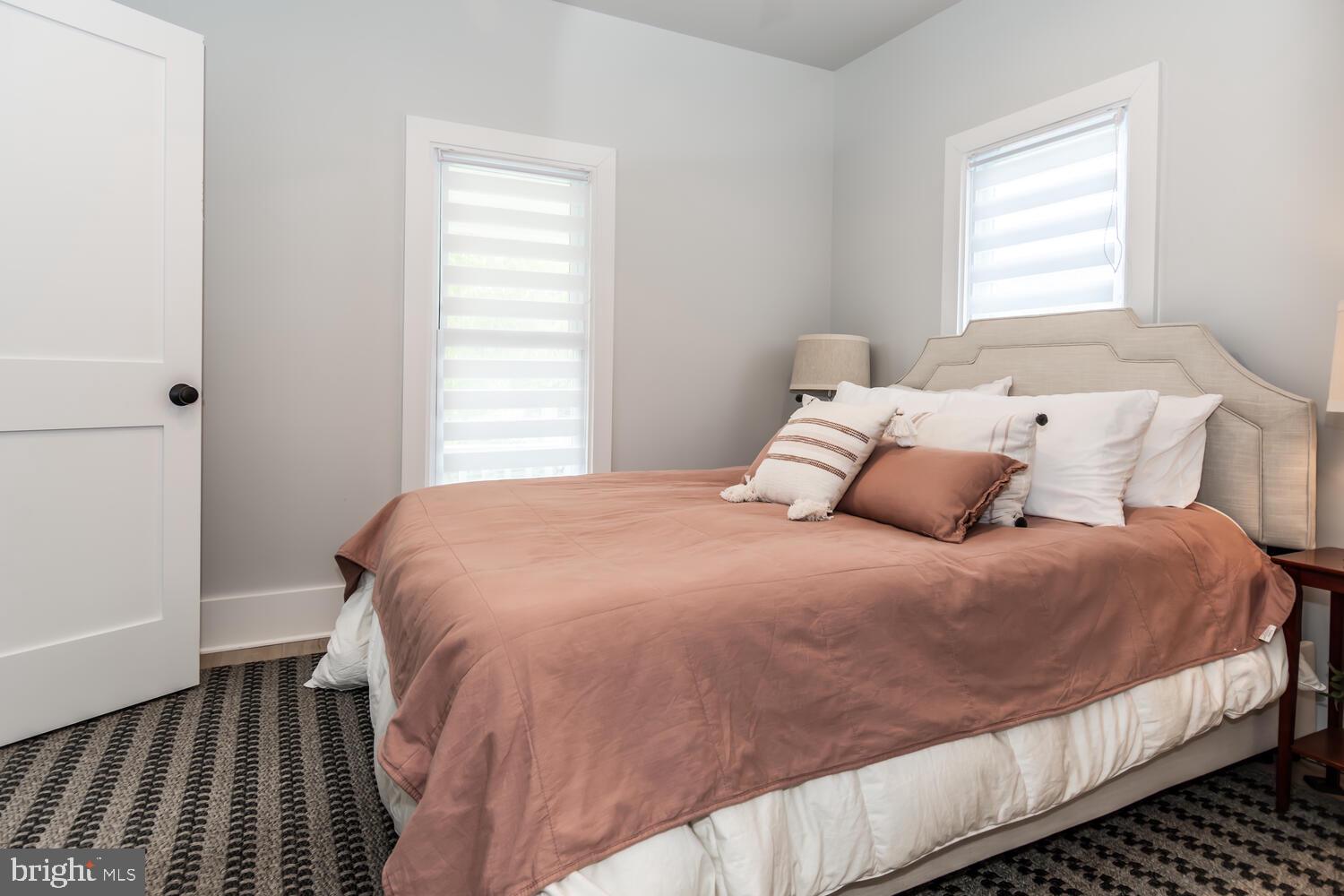 207 Dodson Avenue St. Michaels, MD 21663 - Photo 23 of 44 a bedroom with a bed and a window