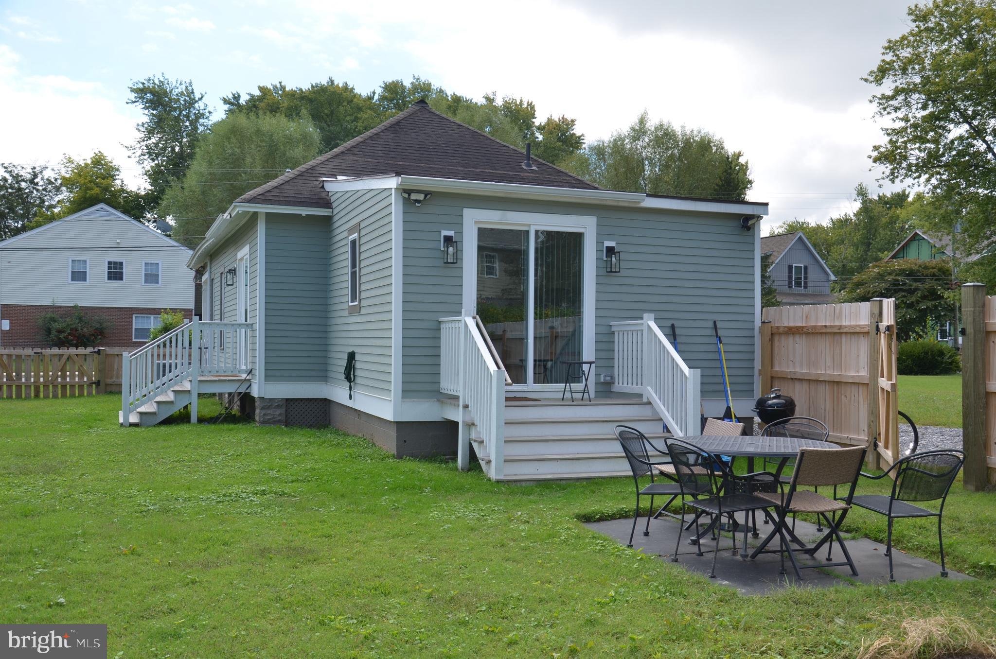 207 Dodson Avenue St. Michaels, MD 21663 - Photo 29 of 44 a view of a house with a yard and sitting area