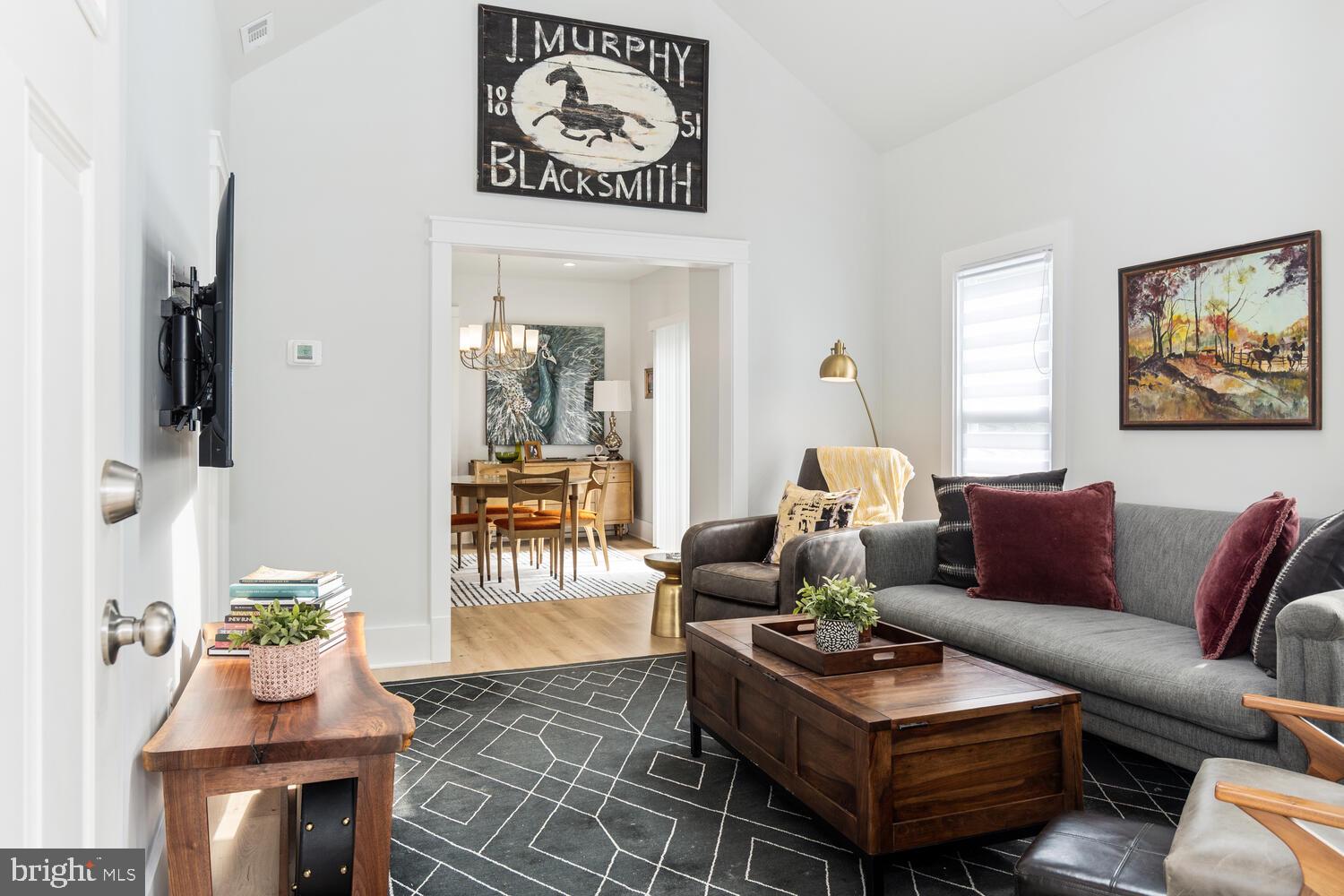 207 Dodson Avenue St. Michaels, MD 21663 - Photo 5 of 44 a living room with furniture and a wooden floor