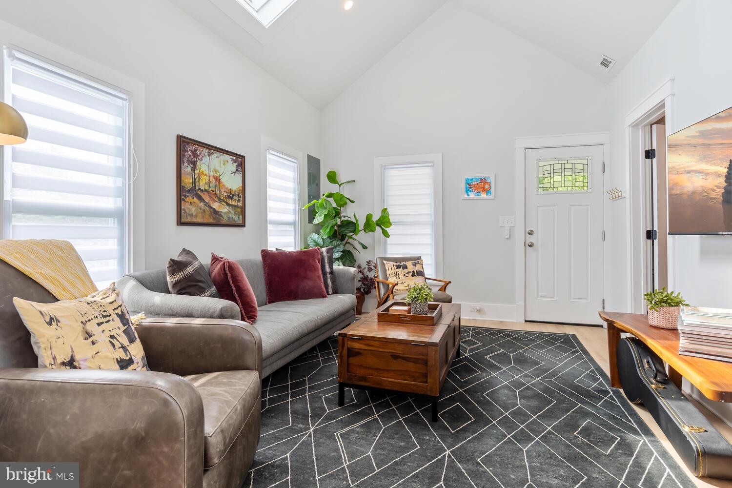 207 Dodson Avenue St. Michaels, MD 21663 - Photo 6 of 44 a living room with furniture and a flat screen tv